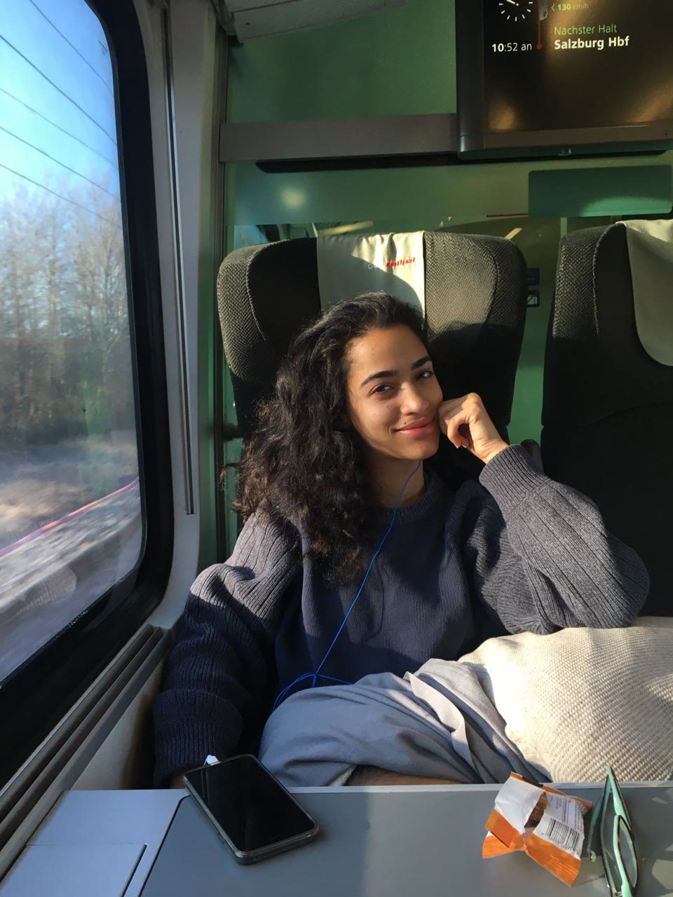 Hazel Mohamedali traveling by train in Europe