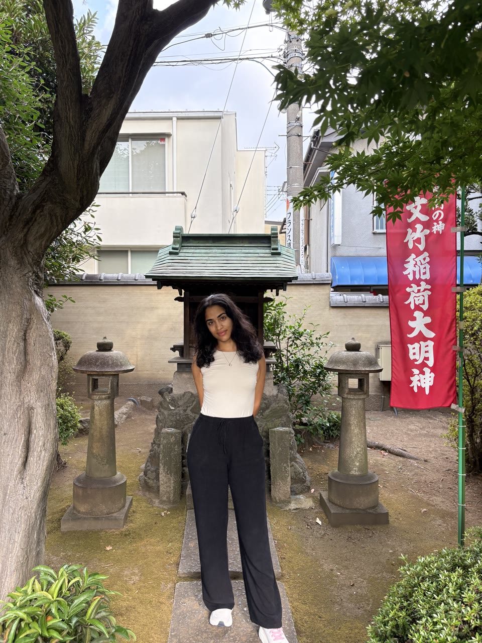Hazel Mohamedali at a shrine in Japan Hazel Mohamedali visiting a neighborhood shrine in Japan