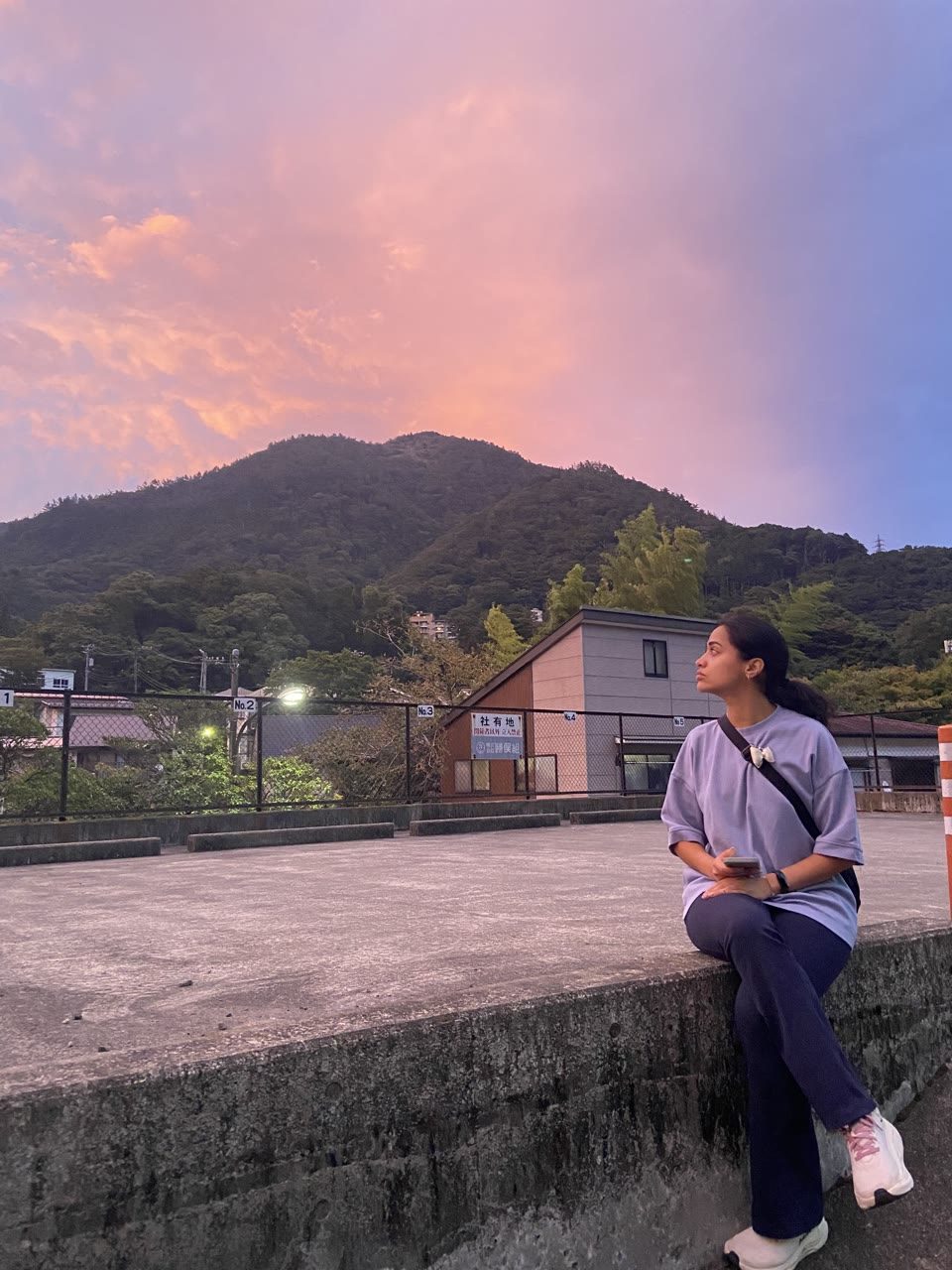 Hazel Mohamedali at sunset in Japan Hazel Mohamedali watching a pink mountain sunset in Japan