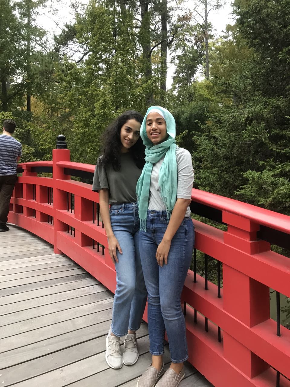 Hazel Mohamedali by a red bridge Hazel Mohamedali standing by a red bridge with a friend